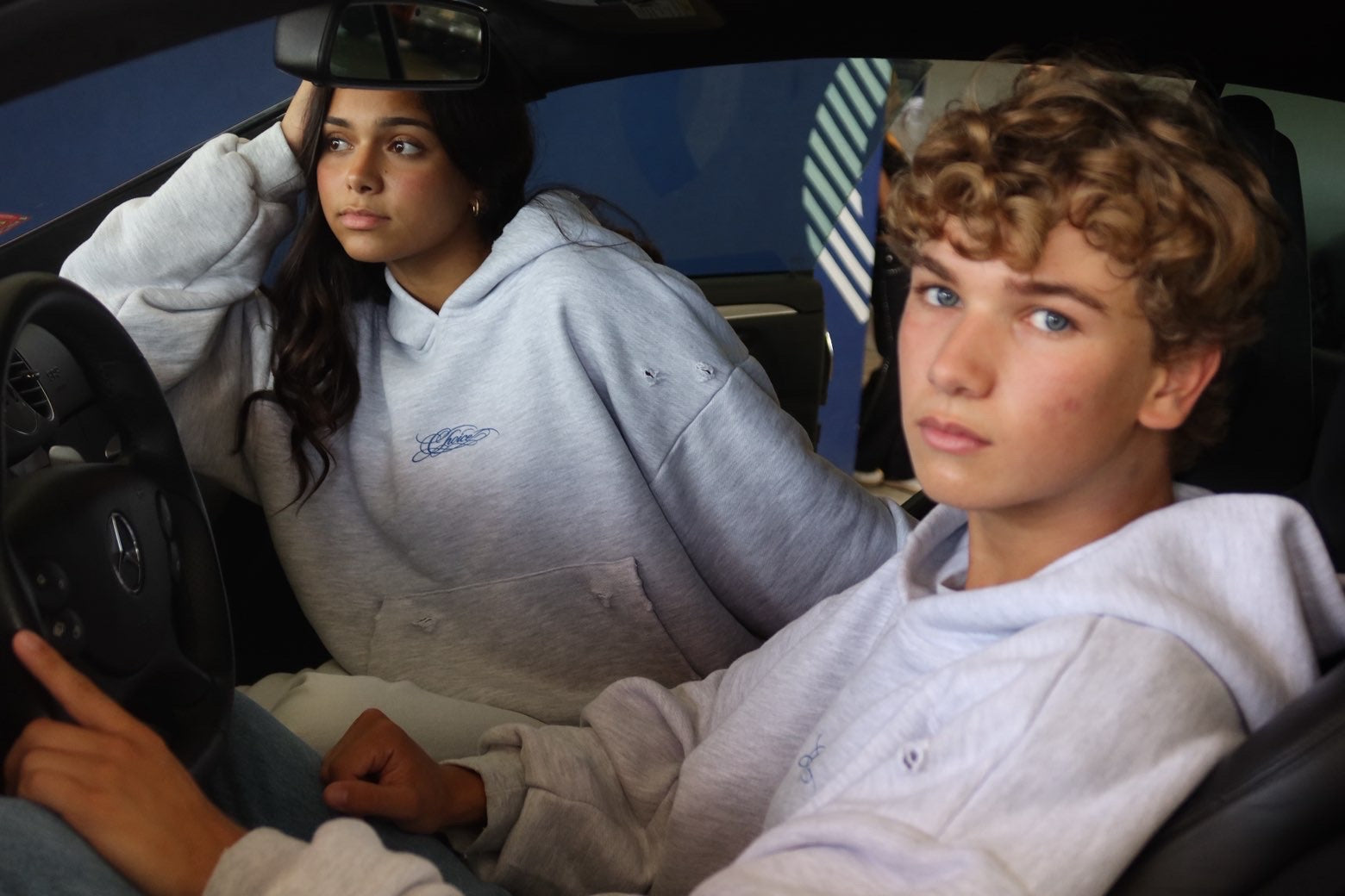 CHOICE hero - two models in car, tight